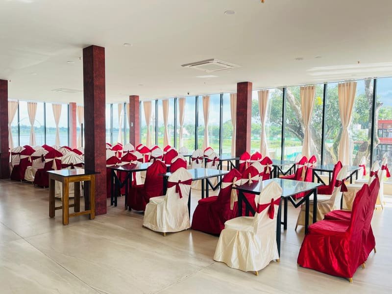 The second banquet hall with tables against a glass wall