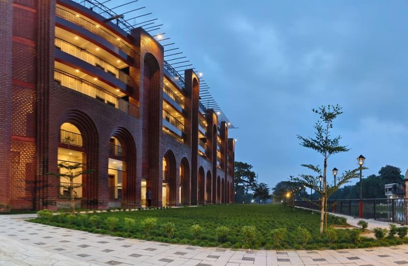 The arcade at dusk with the lawn running alongside