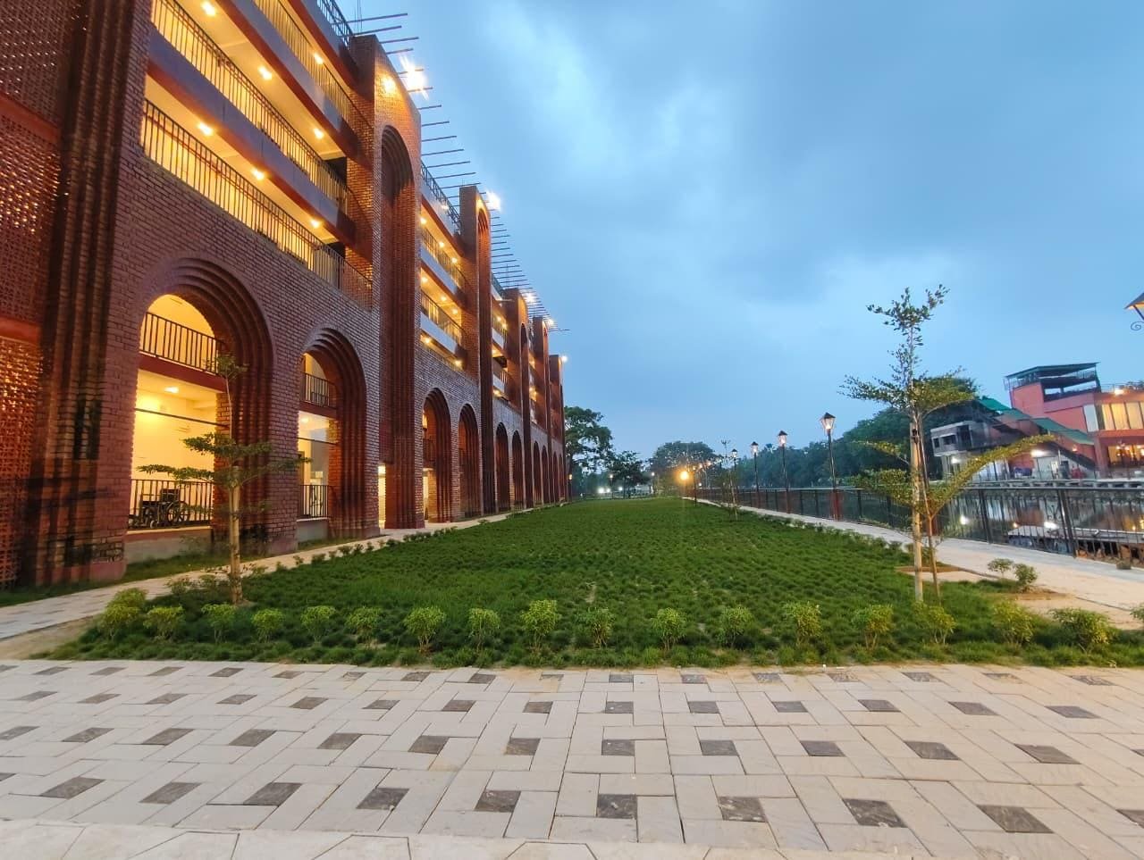 The full run of the resort's brick arcade at dusk