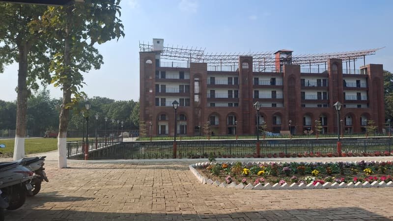 Flowerbeds and paving in front of the resort