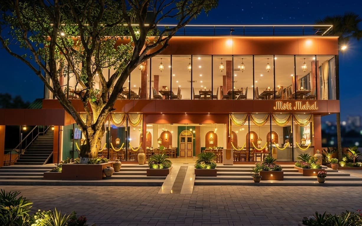 Moti Mahal restaurant lit up beneath a tree after dark