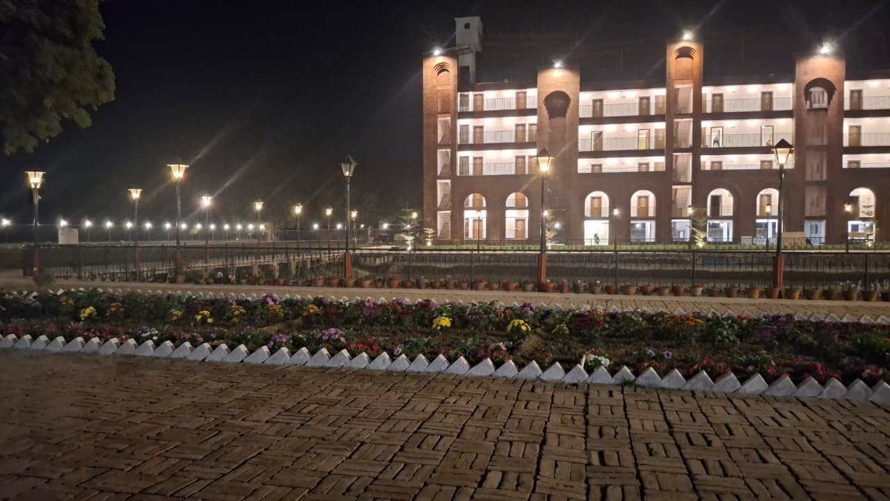 The resort lit at night above its lawns