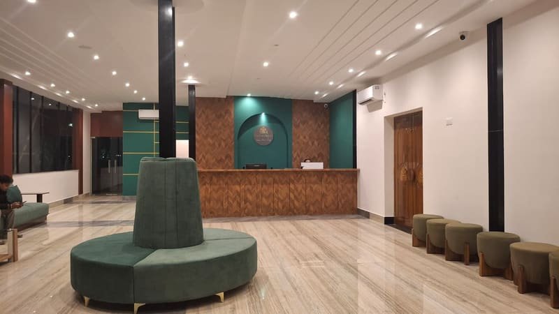 The reception desk under an arched alcove