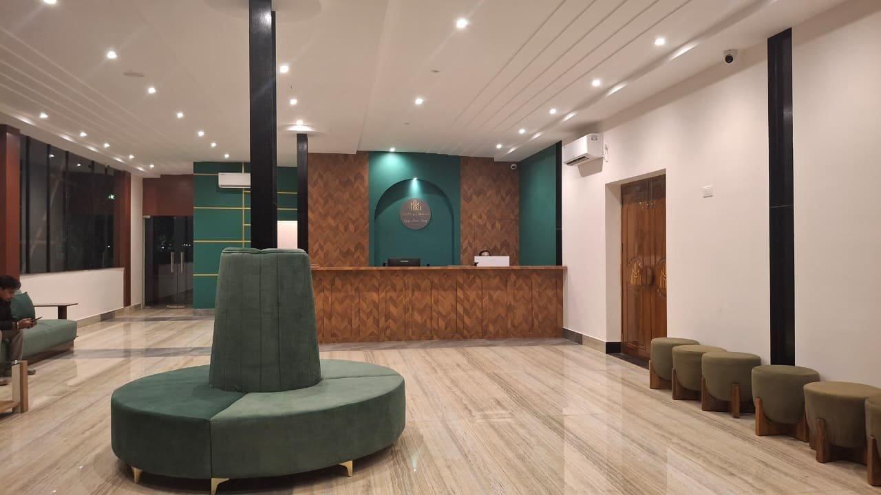 The reception desk set into an arched alcove