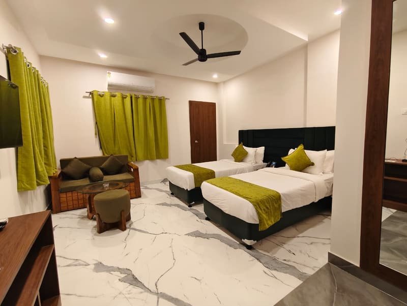 A family room with two beds and a low sofa